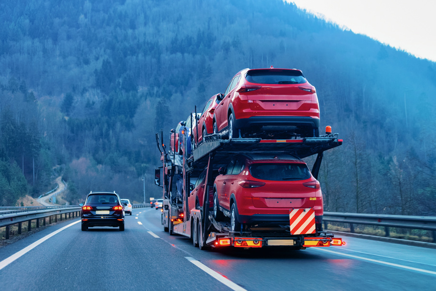 Cars Carrier Transporter Truck on Road Auto Vehicles